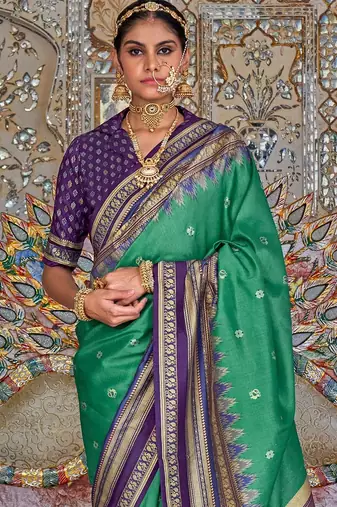 Teal ethnic motifs printed zari sungudi saree
