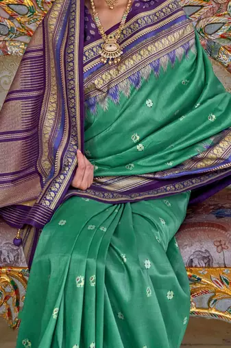 Teal ethnic motifs printed zari sungudi saree