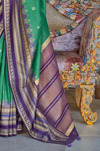 Teal ethnic motifs printed zari sungudi saree