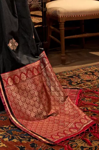 black bagh ethnic motifs woven design zari satin banarasi saree