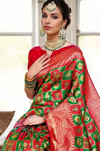 Green woven design zari silk blend kanjeevaram saree