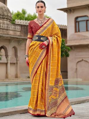 Yellow woven design zari silk blend bandhani saree 1