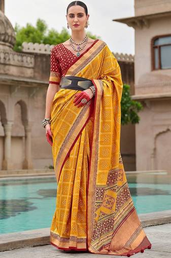 Yellow woven design zari silk blend bandhani saree
