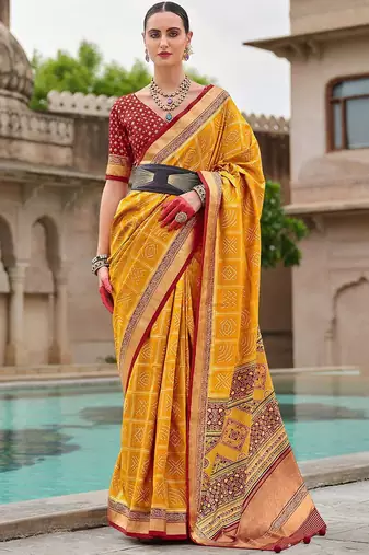 Yellow woven design zari silk blend bandhani saree