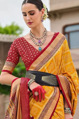 Yellow woven design zari silk blend bandhani saree