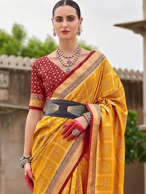 Yellow woven design zari silk blend bandhani saree 3