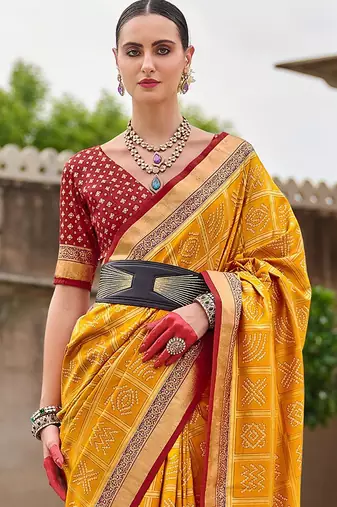 Yellow woven design zari silk blend bandhani saree