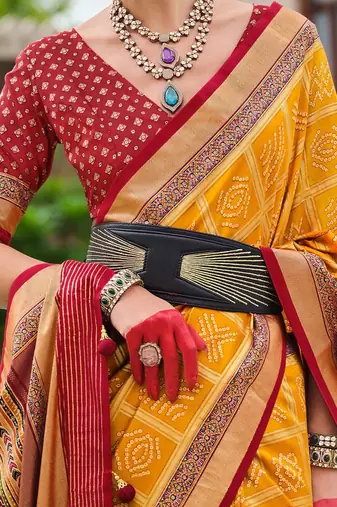 Yellow woven design zari silk blend bandhani saree