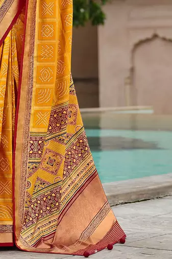 Yellow woven design zari silk blend bandhani saree