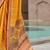 Yellow woven design zari silk blend bandhani saree