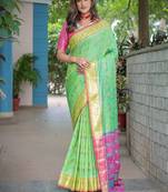 green woven design floral zari kanjeevaram silk blend saree