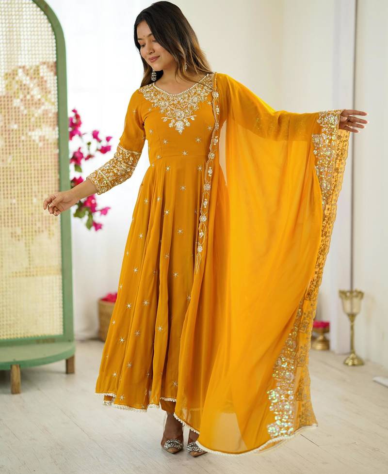 Yellow faux georgette embroidered flared gown set