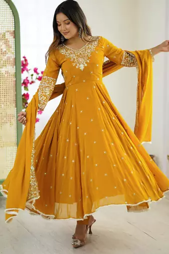 Yellow faux georgette embroidered flared gown set