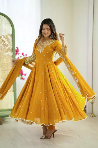Yellow faux georgette embroidered flared gown set