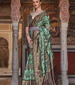 sea green sea green & brown ethnic motif woven design zari banarasi silk blend saree