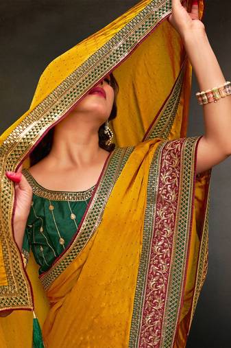 yellow ethnic motifs heavy work saree