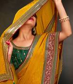 yellow ethnic motifs heavy work saree
