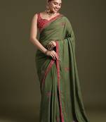 Green floral embroidered sequinned tissue saree with matching blouse