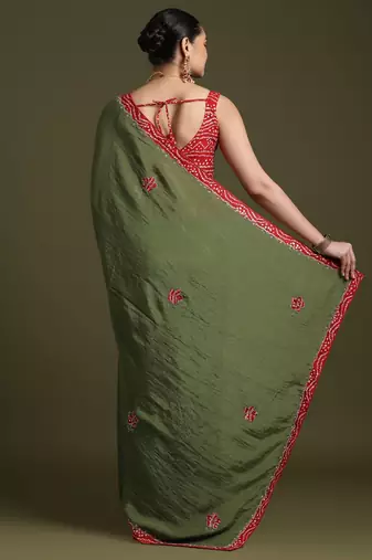 Green floral embroidered sequinned tissue saree with matching blouse