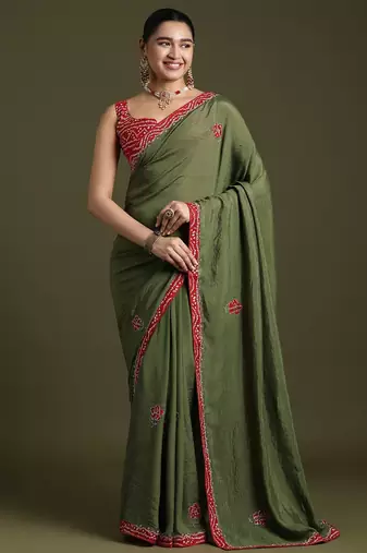 Green floral embroidered sequinned tissue saree with matching blouse
