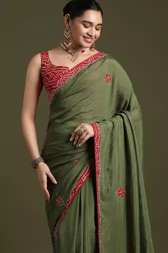 Green floral embroidered sequinned tissue saree with matching blouse