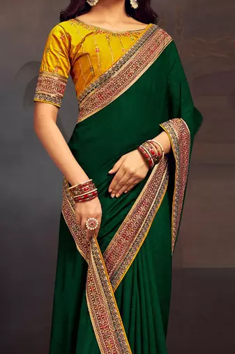 Green embroidered party saree