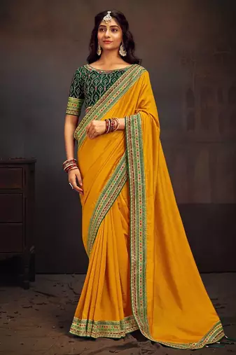 Yellow embroidered party wear saree