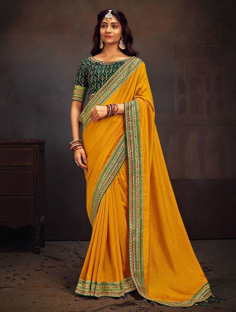 Yellow embroidered party wear saree