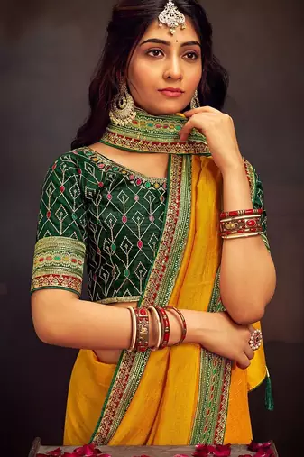 Yellow embroidered party wear saree