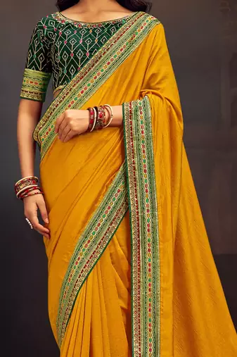 Yellow embroidered party wear saree