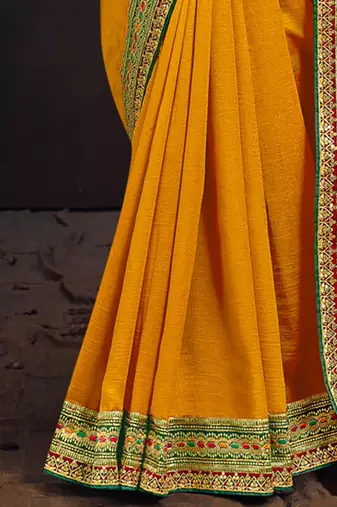 Yellow embroidered party wear saree