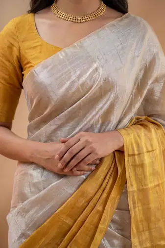 Off white woven design tissue kasavu saree