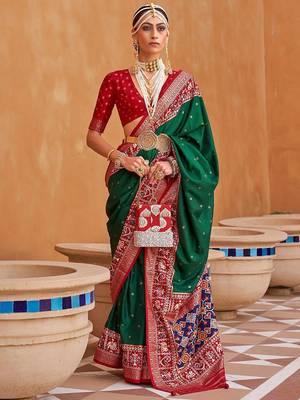 Green ethnic motifs woven design patola saree 1