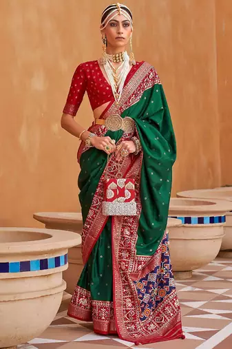 Green ethnic motifs woven design patola saree