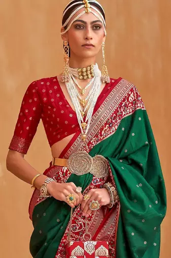 Green ethnic motifs woven design patola saree
