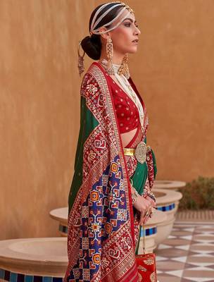 Green ethnic motifs woven design patola saree 3