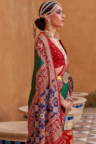 Green ethnic motifs woven design patola saree