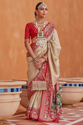 Cream cream-coloured & red woven design zari silk blend patola saree