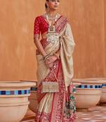 Cream cream-coloured & red woven design zari silk blend patola saree