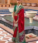Red ethnic motifs woven design zari patola saree