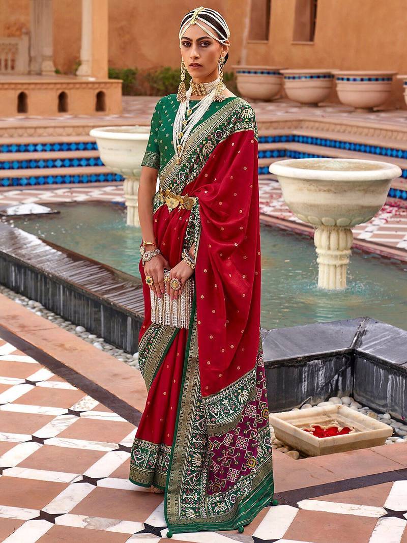 Red ethnic motifs woven design zari patola saree