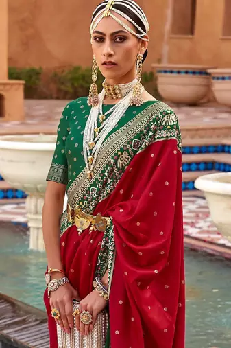 Red ethnic motifs woven design zari patola saree