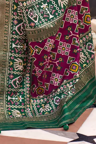 Red ethnic motifs woven design zari patola saree