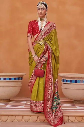 Olive ethnic motifs woven design zari patola saree