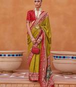 Olive ethnic motifs woven design zari patola saree