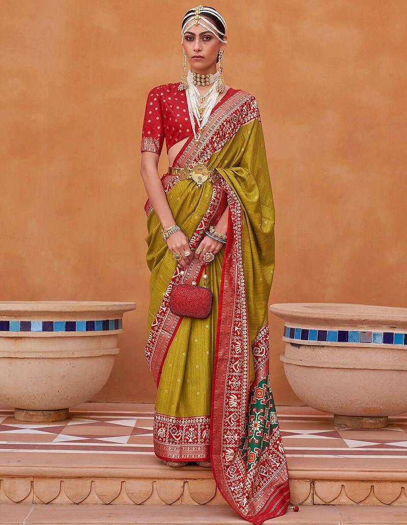 Olive ethnic motifs woven design zari patola saree