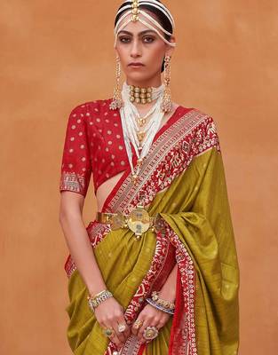 Olive ethnic motifs woven design zari patola saree 2