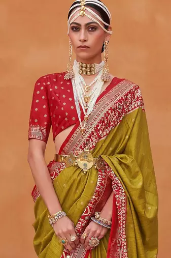 Olive ethnic motifs woven design zari patola saree