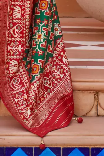 Olive ethnic motifs woven design zari patola saree