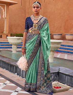Sea green woven design zari silk blend patola saree 1